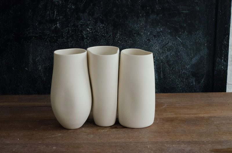 Three porcelain beakers in soft matte white